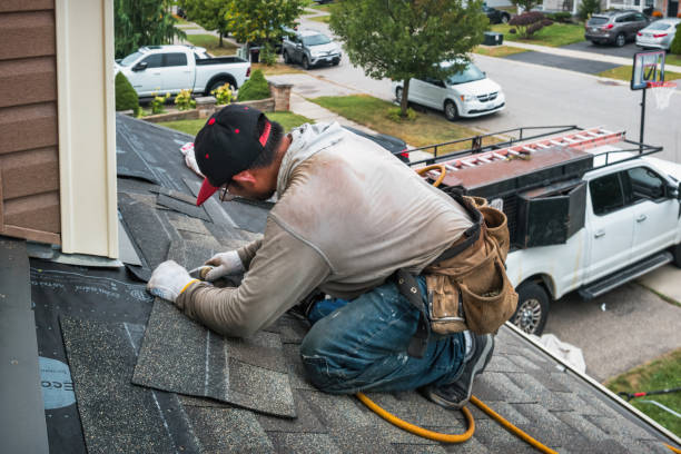 Professional Gutter Installation technician working in Wellesley Hills, MA